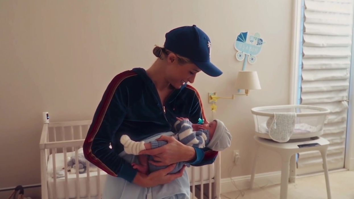 Paris Hilton learns how to change her baby's nappy a month after he's born