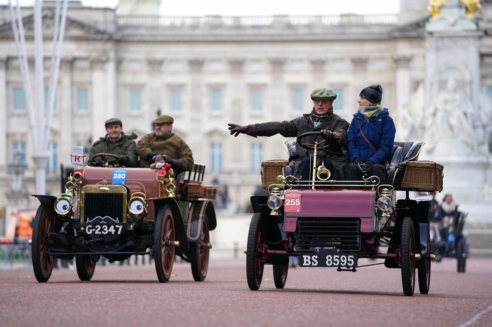 Participants in the RM Sotheby\u2019s London to Brighton Veteran Car Run drive along The Mall (Kirsty O\u2019Connor/PA)