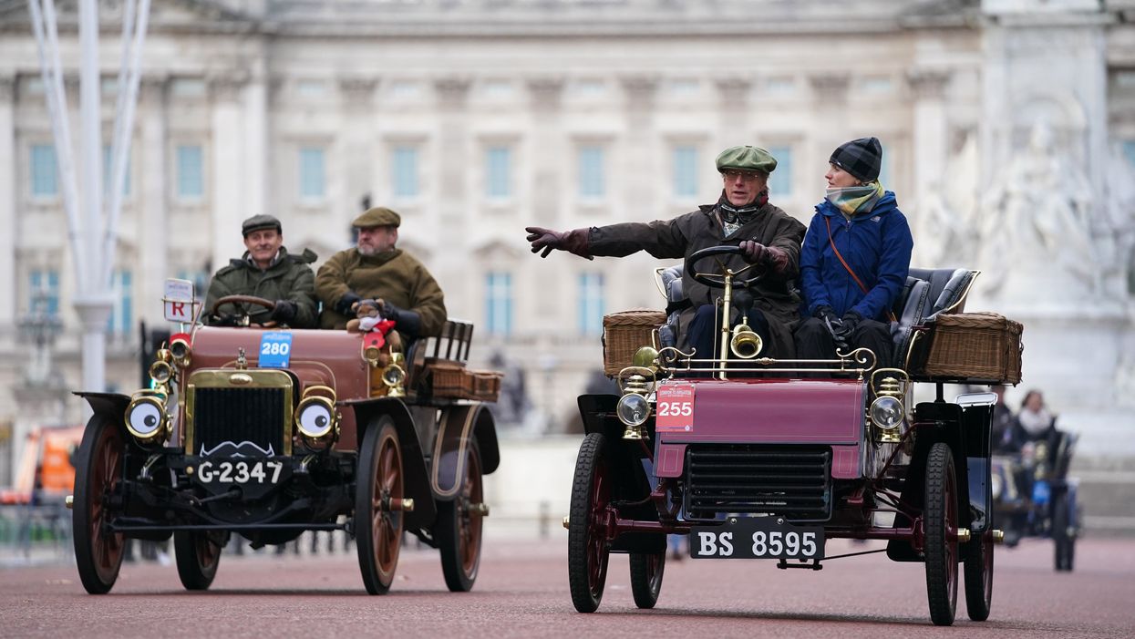 Participants in the RM Sotheby’s London to Brighton Veteran Car Run drive along The Mall (Kirsty O’Connor/PA)