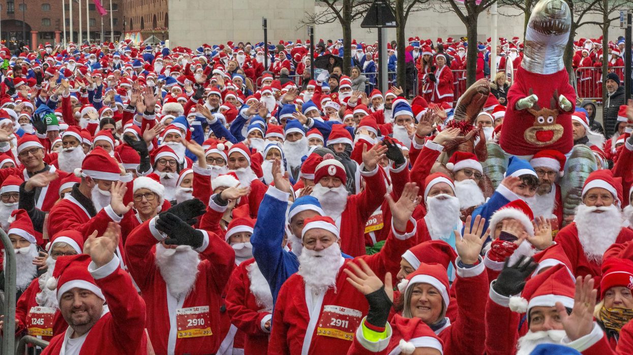 Participants taking part in the Liverpool Santa Dash in Liverpool in aid of Alder Hey Children’s Hospital (Jason Roberts/PA)
