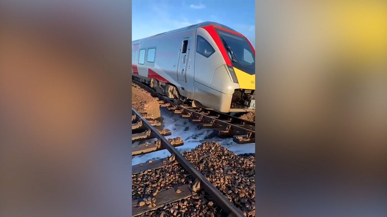 Passenger train stranded as storm causes tracks to collapse during flood
