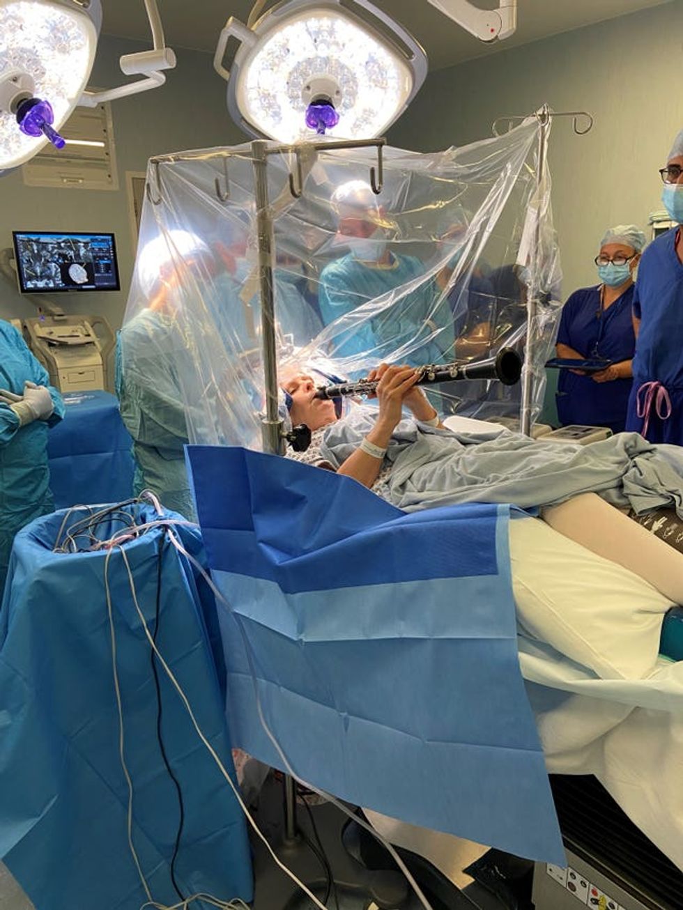 Patient plays clarinet during surgery