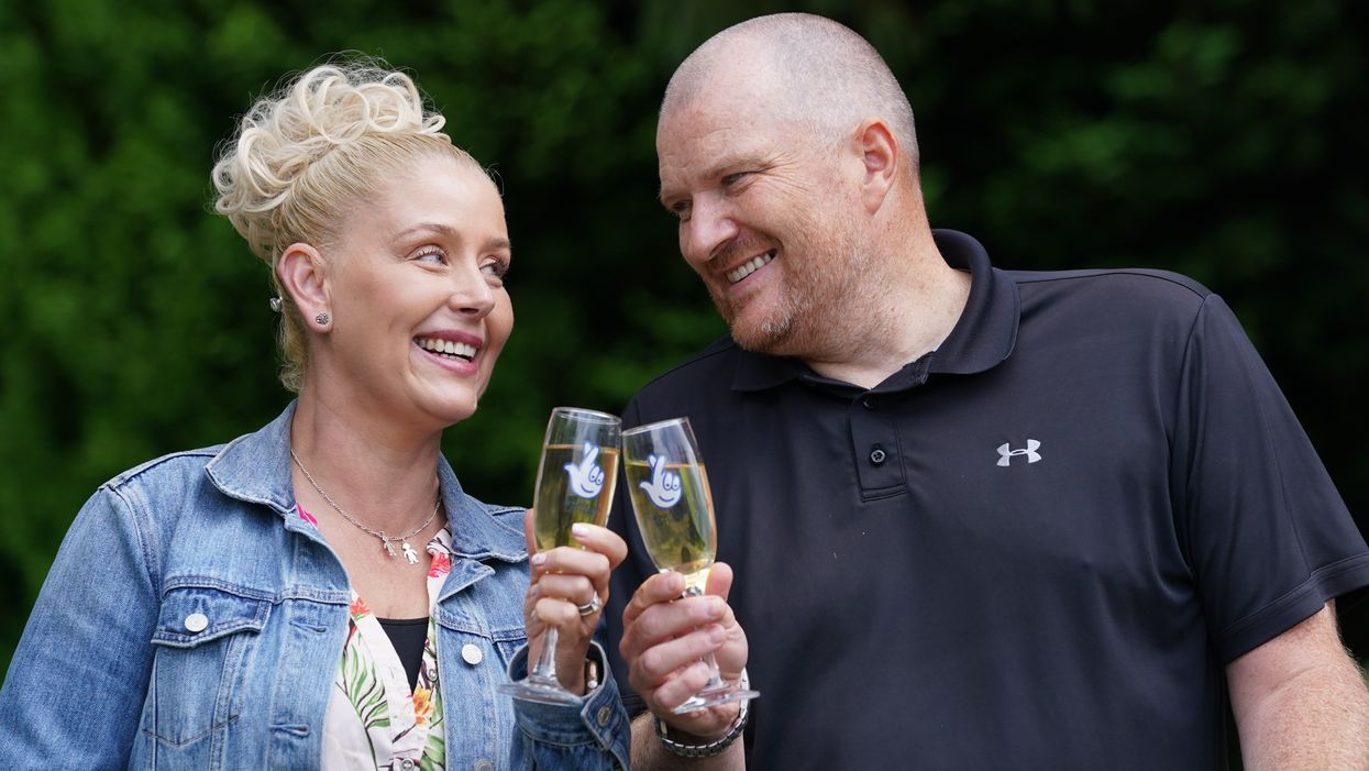 Paul and Louise Drake, from Seafield near Bathgate, celebrate their win (Andrew Milligan/PA)