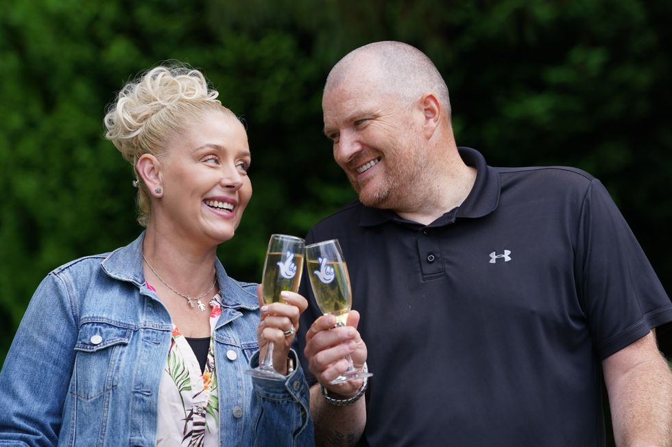 Paul and Louise Drake, from Seafield near Bathgate, celebrate their win (Andrew Milligan/PA)