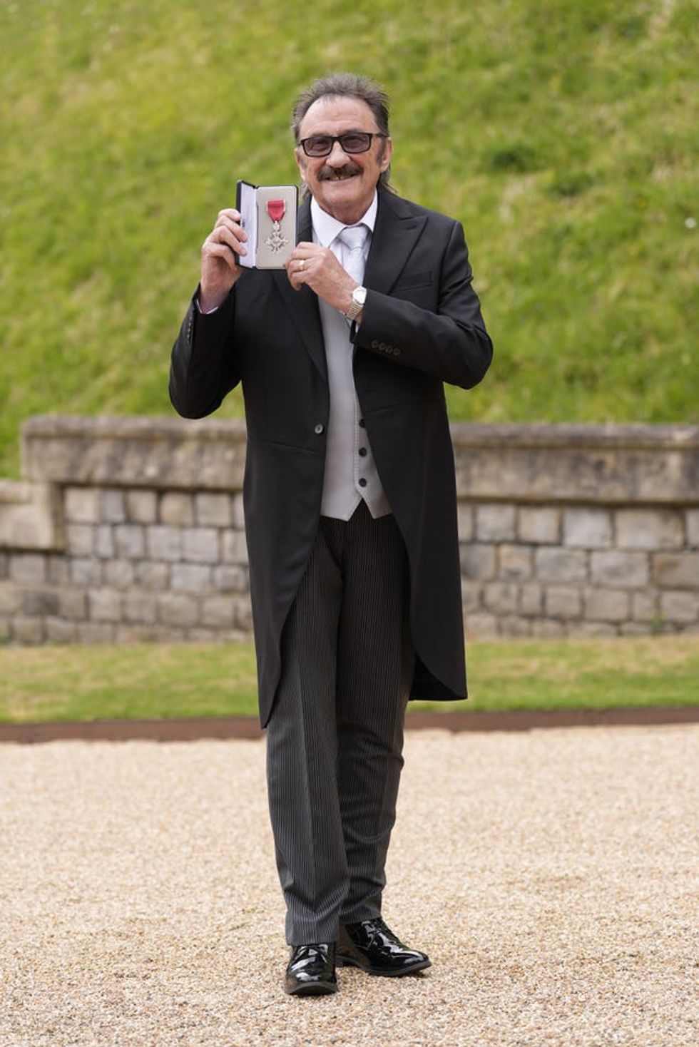 Paul Elliott after being made a Member of the Order of the British Empire by the King at Windsor Castle, Berkshire
