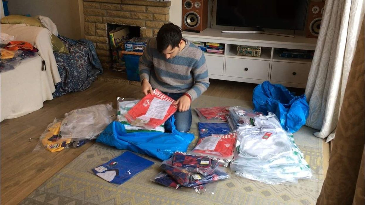 Paul Watson with donated football shirts (Kitmas)