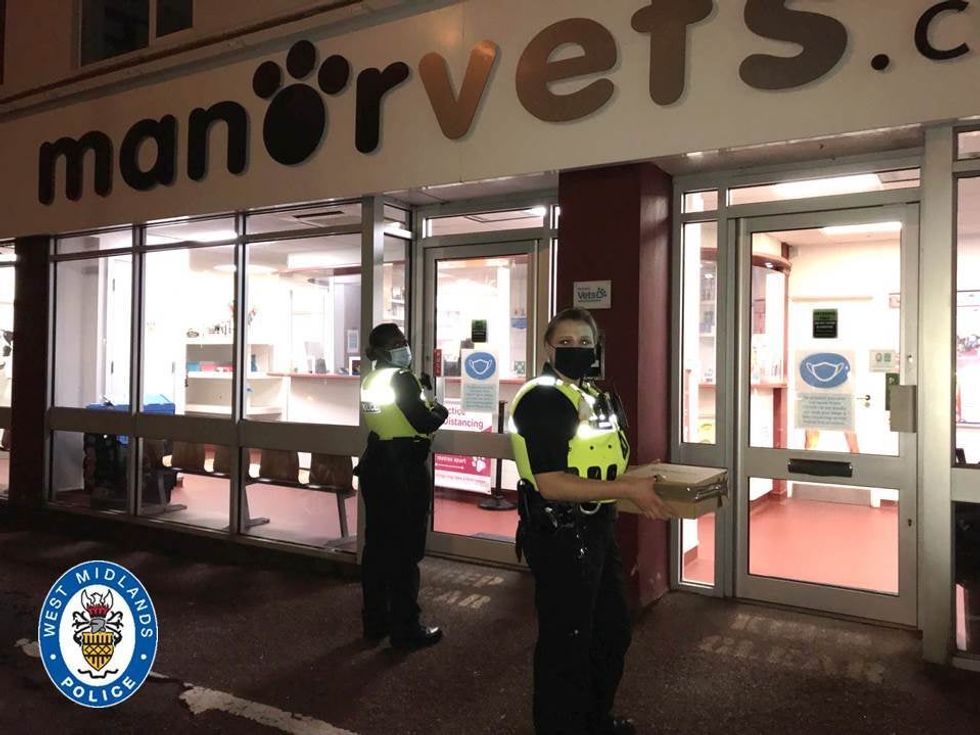 Pc Bethan Pinnock with a 5ft long female python (West Midlands Police/PA)
