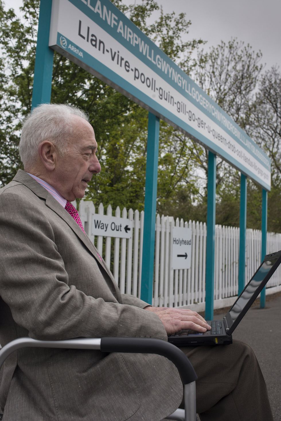 Pensioner and charity worker Alwyn Ellis uses a laptop at the station (Welsh Government News/PA)