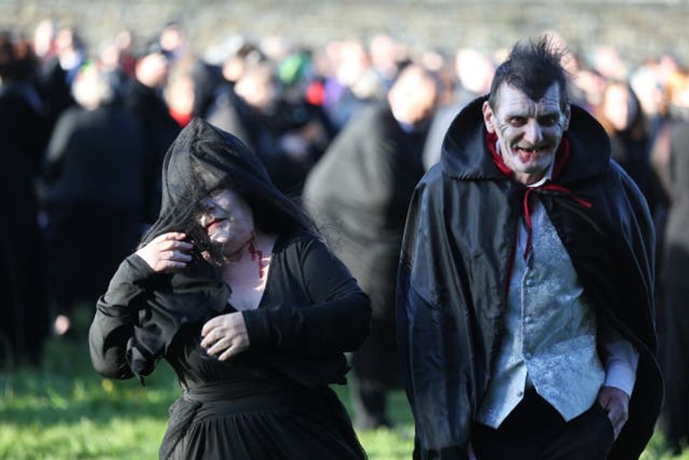 People dressed as Vampires at Whitby Abbey in Yorkshire, as they attempt to set a new Guinness World Record for the most amount of vampires in one place on the on 125th anniversary of the publication of Dracula. Picture date: Thursday May 26, 2022