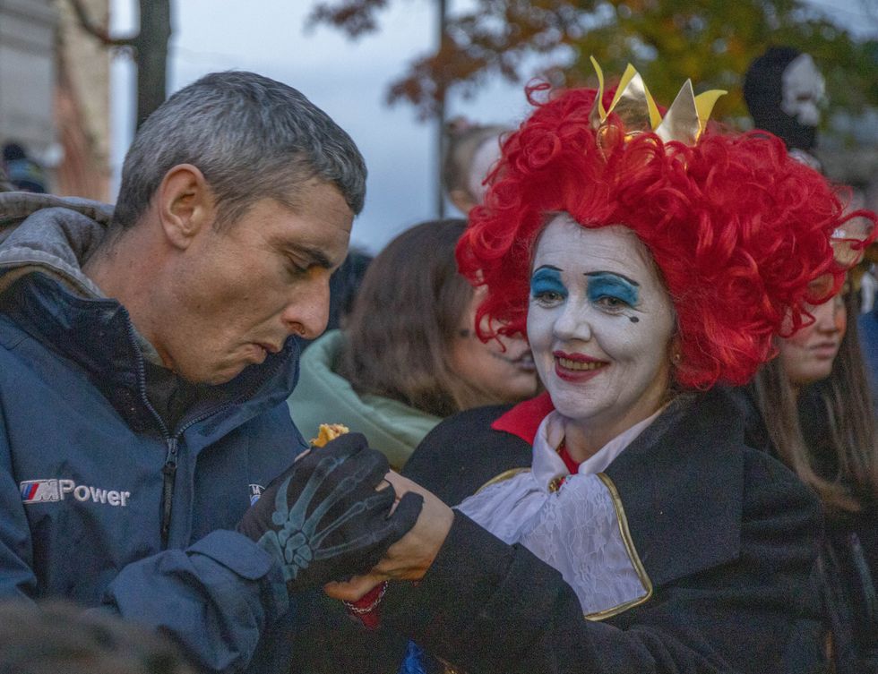 People enjoying the final night of the three-day Halloween festival in Londonderry, which returned this year after being cancelled in 2020 due to the coronavirus pandemic (Joe Boland/PA)