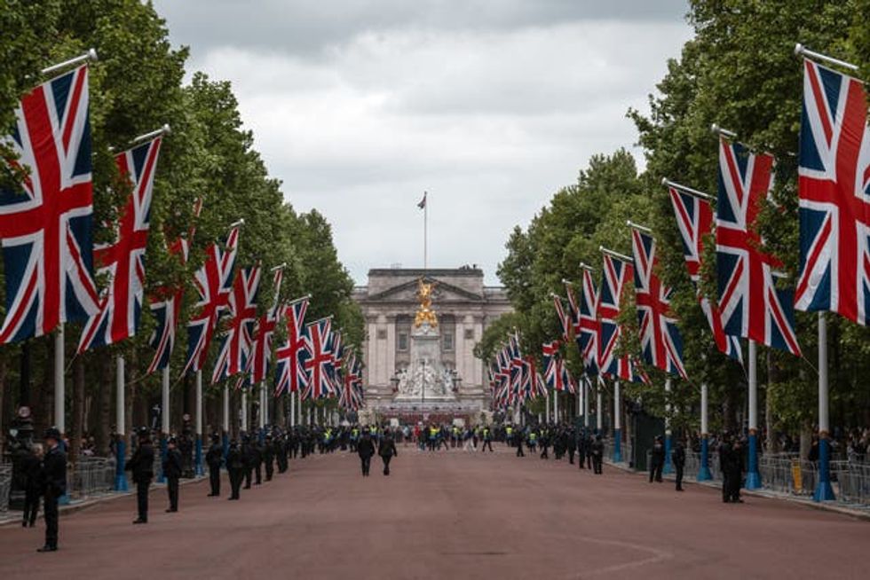 People gather on The Mall ahead of a military procession marking the 80th anniversary of VE Day