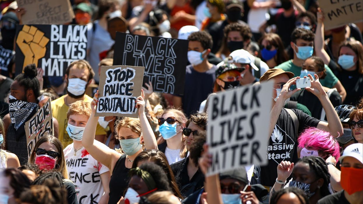 <p>People hold placards as they join a spontaneous Black Lives Matter march at Trafalgar Square to protest the death of George Floyd in Minneapolis and in support of the demonstrations in North America on May 31, 2020 in London.</p>