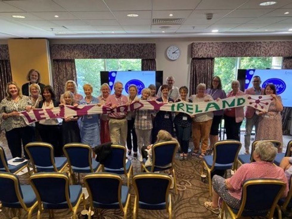 People holding a scarf