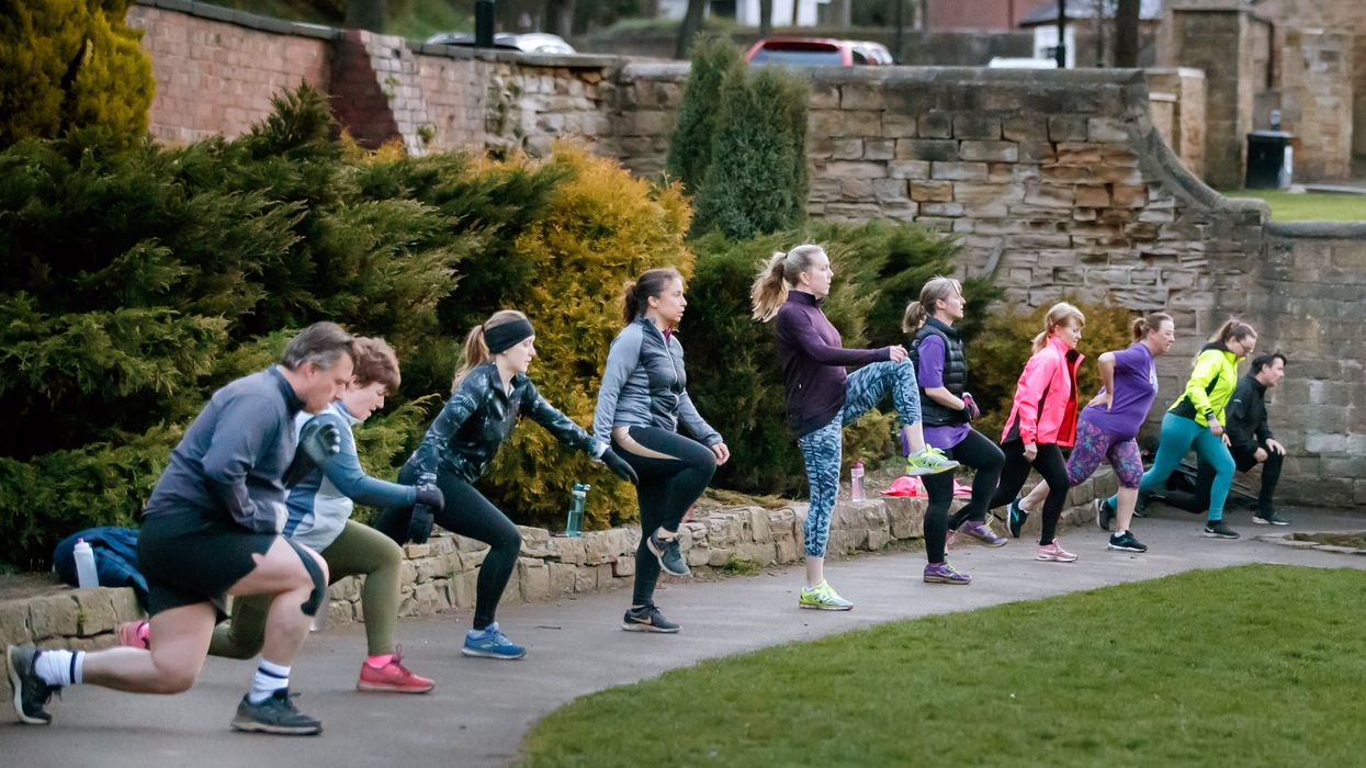 People take part in a bootcamp exercise class in Springhead Park, Rothwell, Leeds