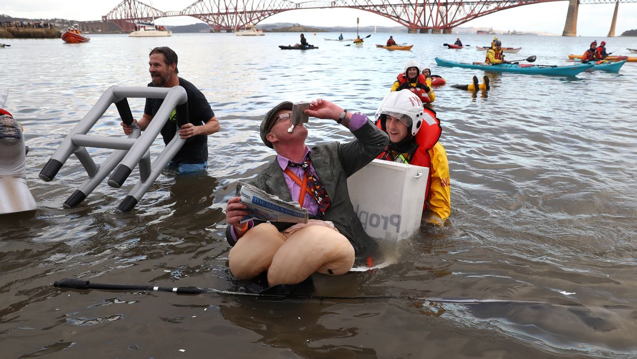 People take part in the annual Loony Dook (Andrew Milligan/PA)