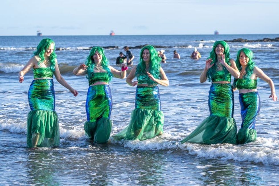 People taking part in the Loony Dook in the Firth of Forth at Kinghorn