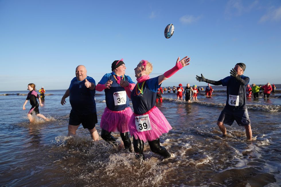 In Pictures: Revellers take the plunge with New Year’s Day dip in icy waters