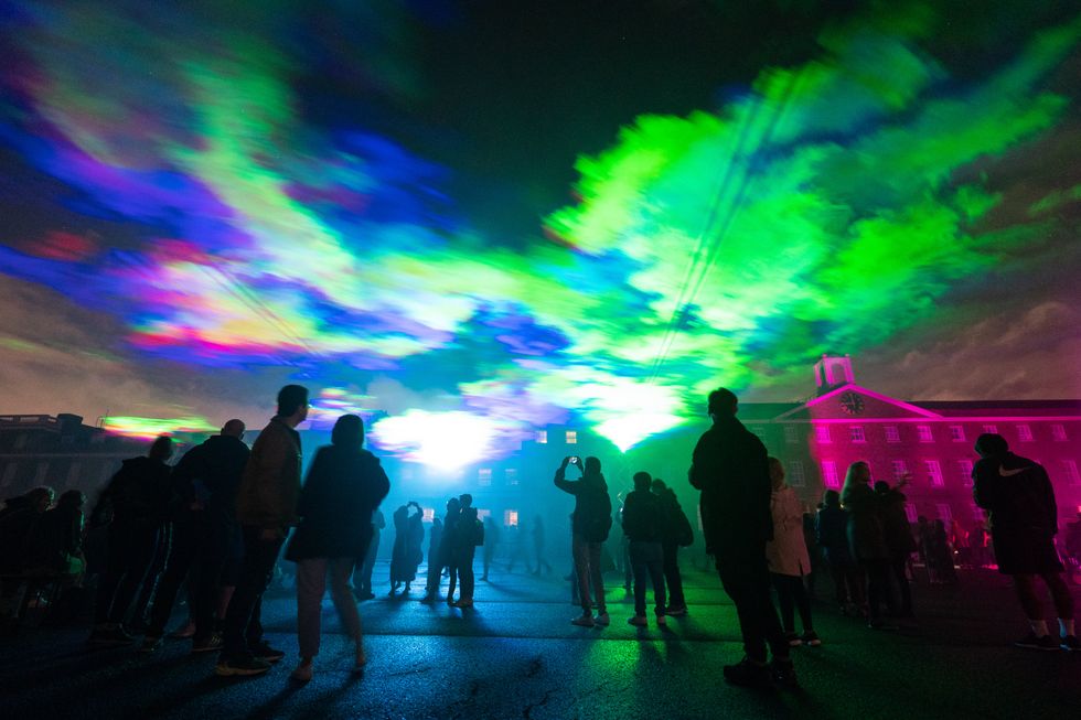 People view \u2018Borealis\u2019 a laser light art installation by Dan Acher (Dominic Lipinski/PA)