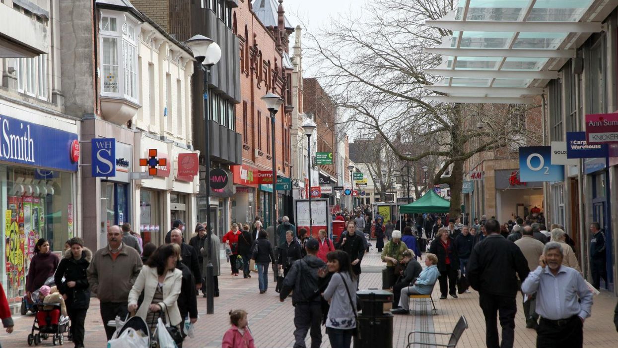 People walk around the centre of Swindon in 2010