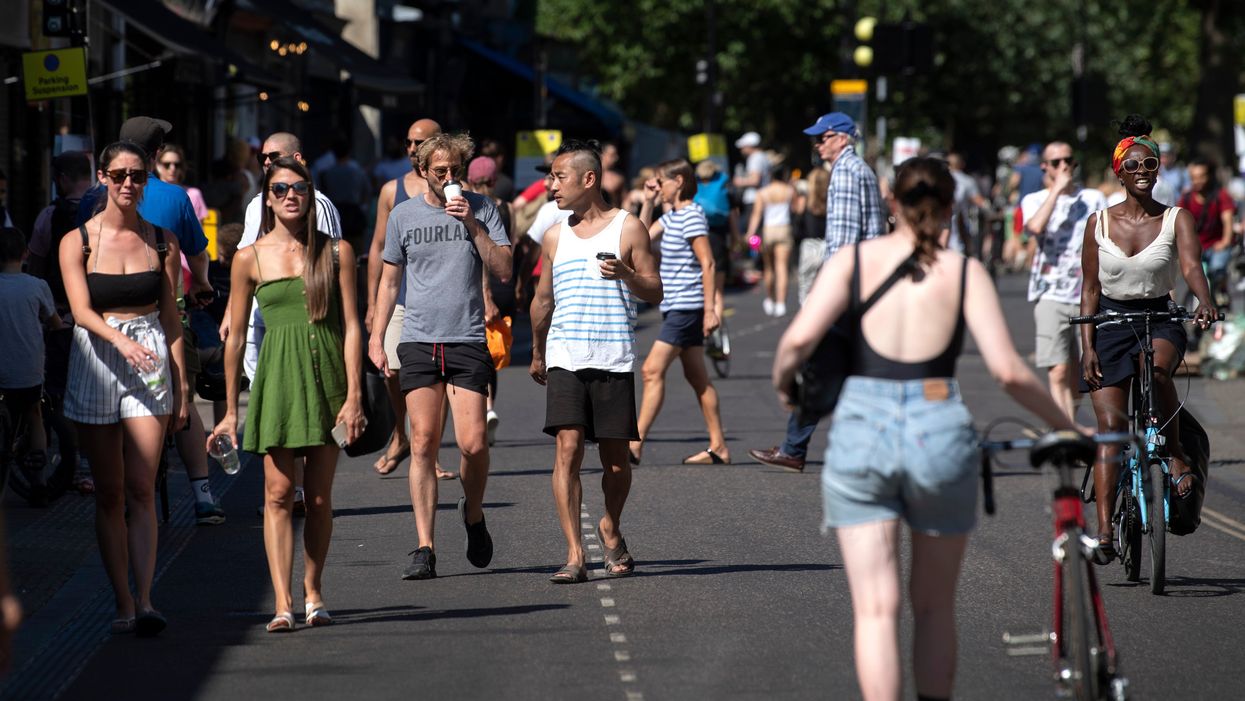 <p>People walking in Broadway Market</p>