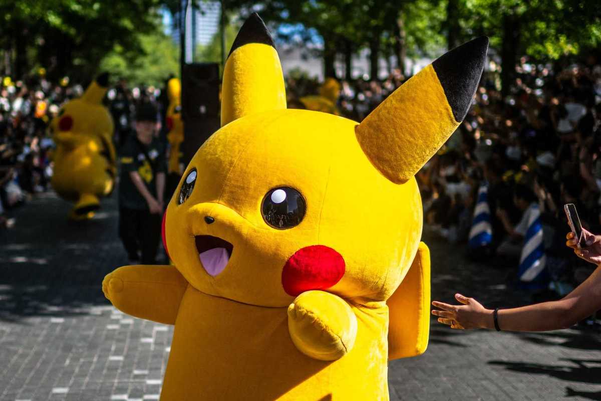 People watch the Pikachu parade which is a part of the 2023 Pokémon World Championships, at Grand Mall Park in Yokohama on August 11, 2023