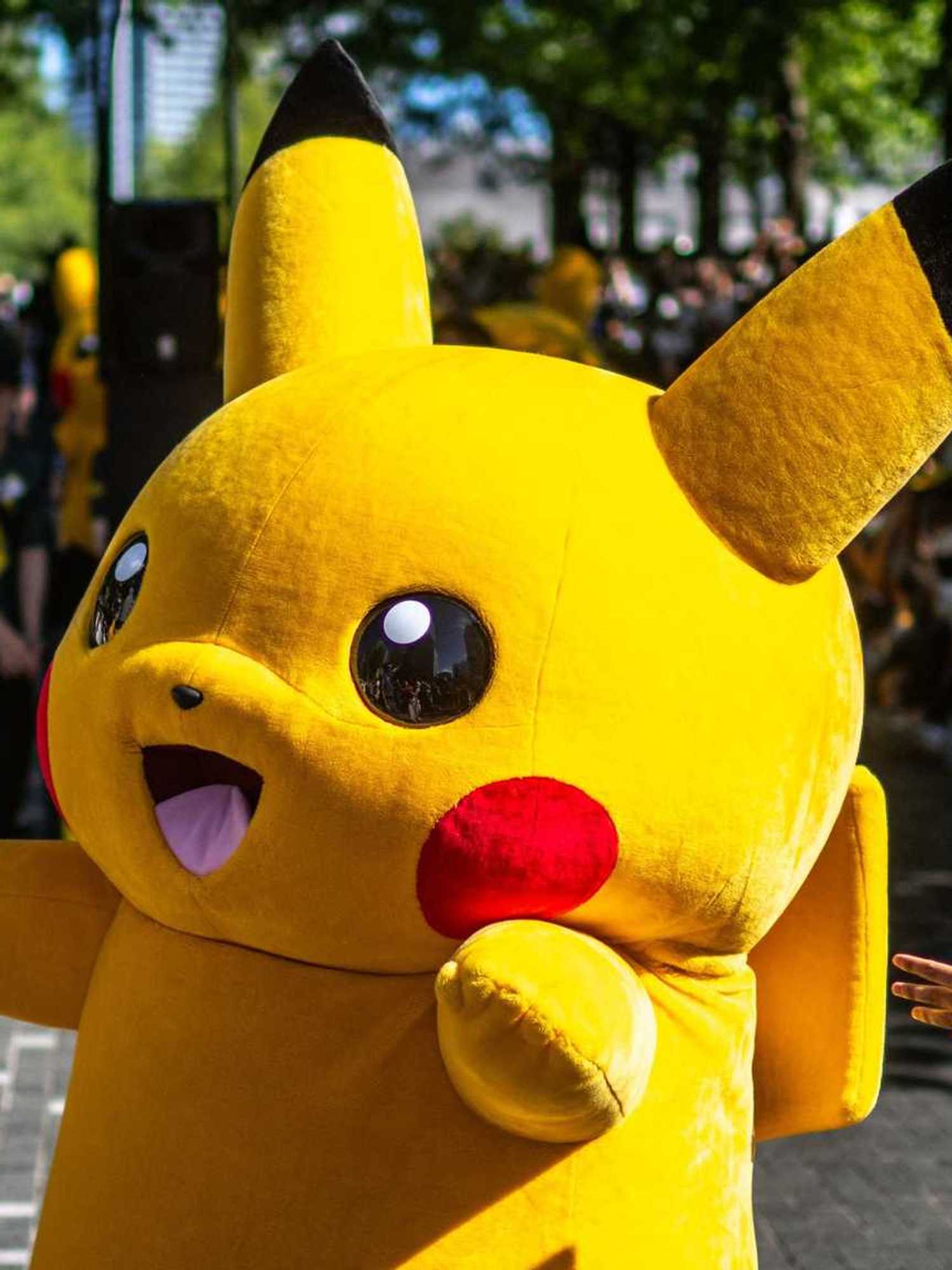 People watch the Pikachu parade which is a part of the 2023 Pokémon World Championships, at Grand Mall Park in Yokohama on August 11, 2023