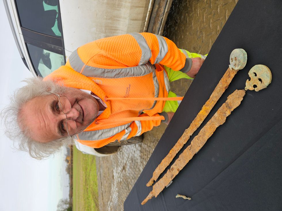 Peter Busby with the two swords (James Harris/PA)