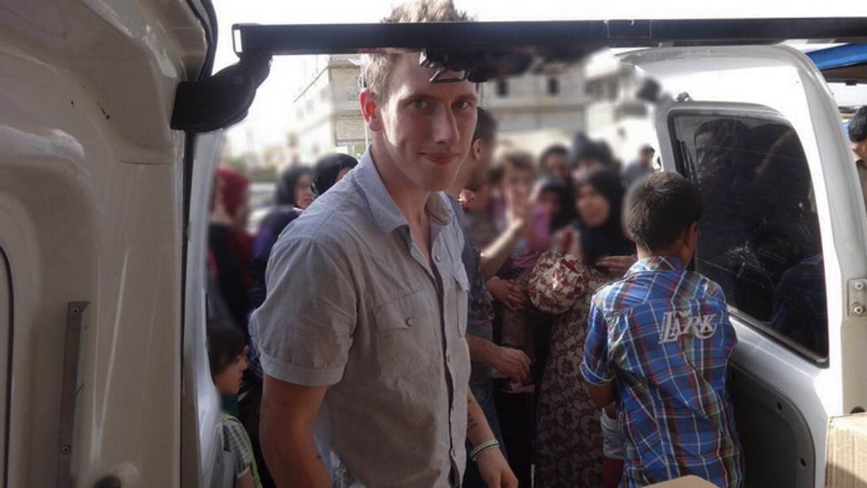 Peter Kassig delivering aid in Bekaa Valley, in Lebanon; May, 2013