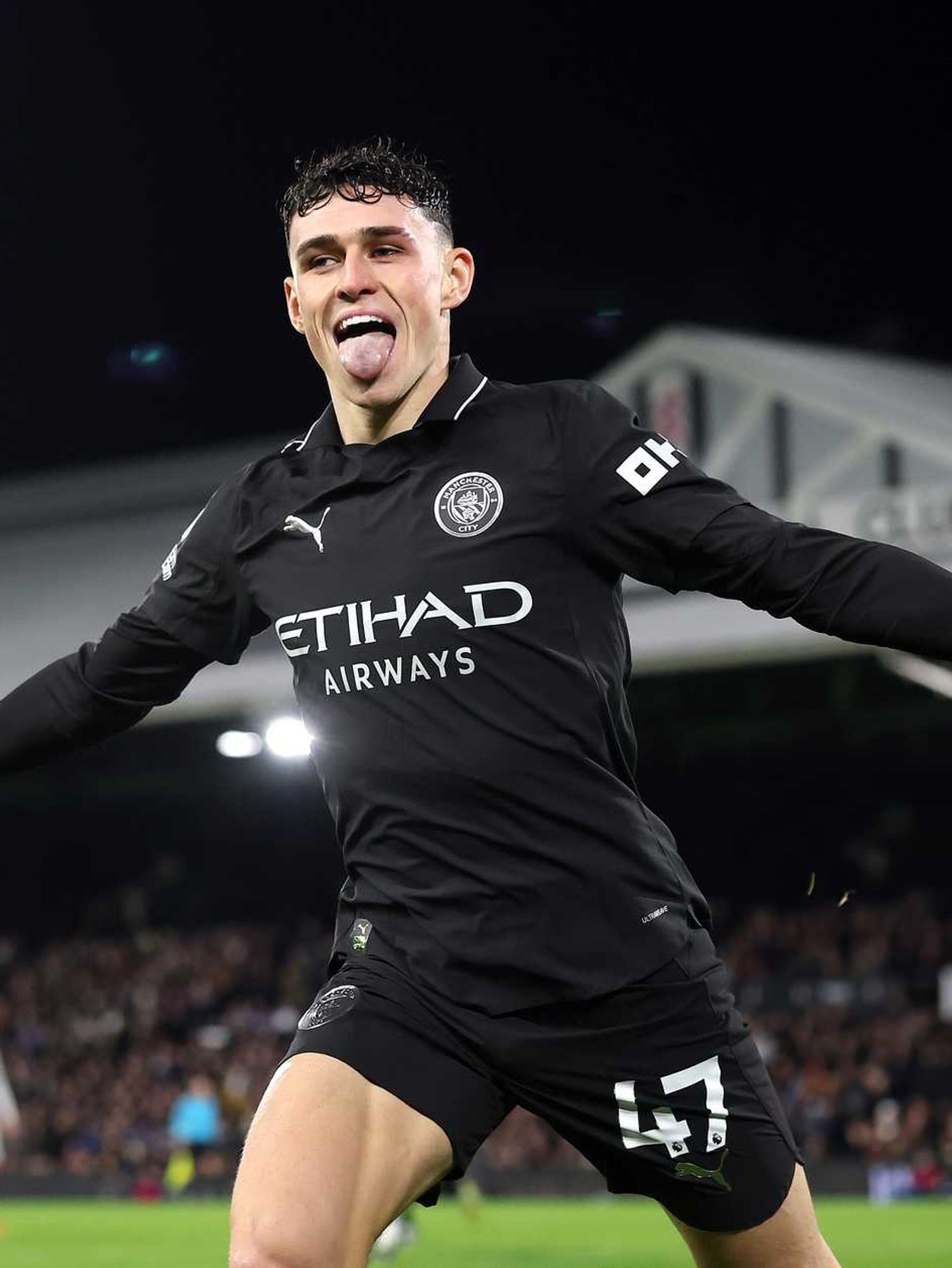Phil Foden of Manchester City celebrates scoring his sides fourth goal during the Premier League match between Fulham and Manchester City at Craven Cottage on December 02, 2025 in London, England