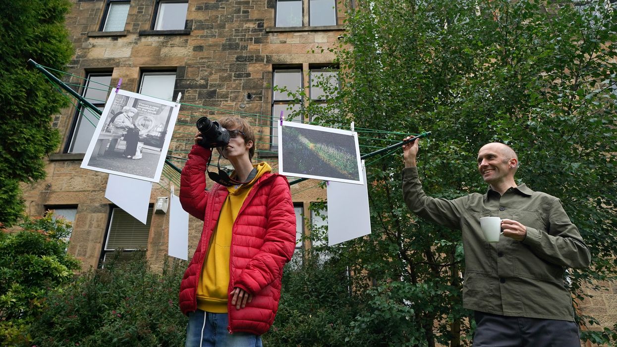 Photographers Brian Hartley and Dylan Lombard (L) at their exhibition (Andrew Milligan/PA)