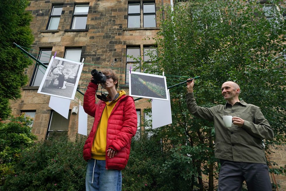 Photographers Brian Hartley and Dylan Lombard (L) at their exhibition (Andrew Milligan/PA)
