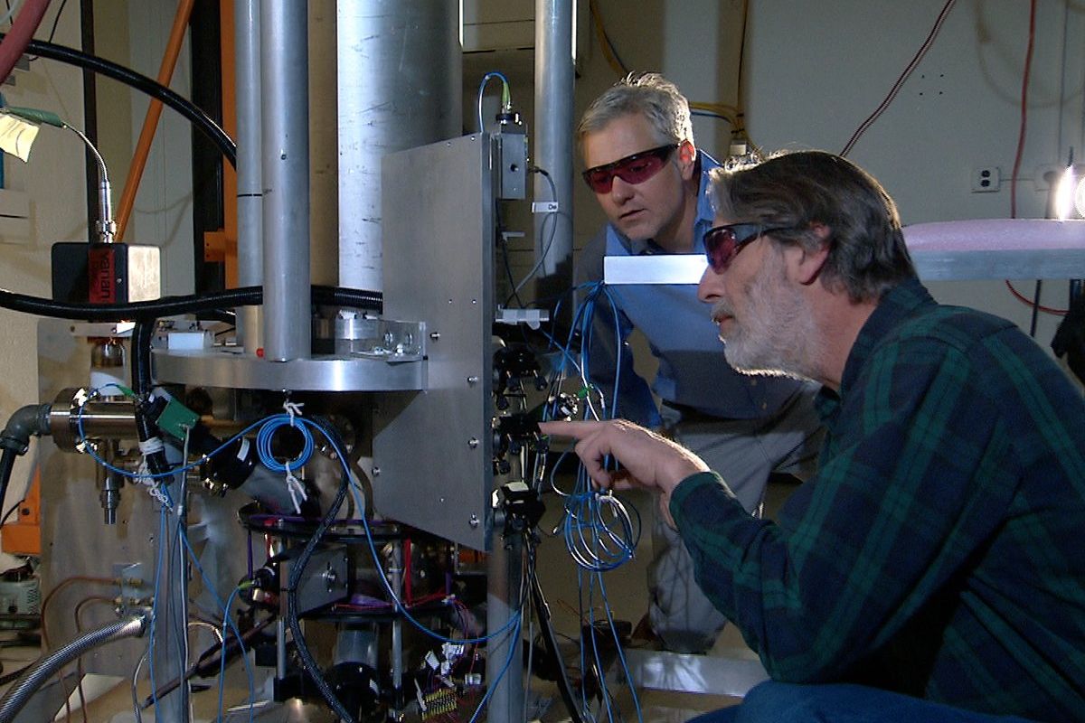 Physicists Steve Jefferts (front) and Tom Heavner with the NIST-F2 caesium fountain atomic clock, a civilian time standard for the United States