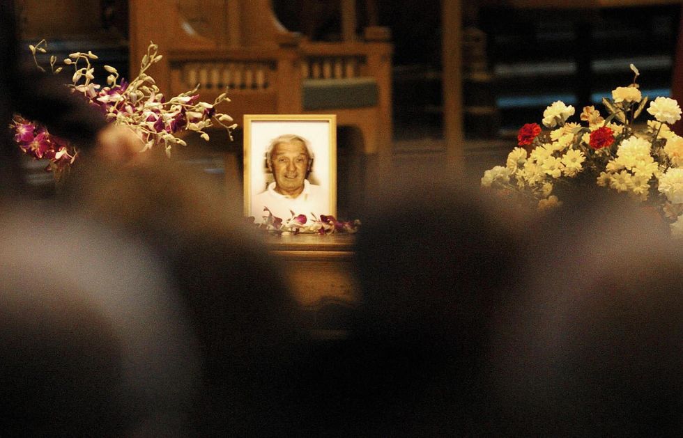 Picture: A photo of Ken Bigley is displayed at Liverpool's Anglican Cathedral during the memorial service. 13 November, 2004.