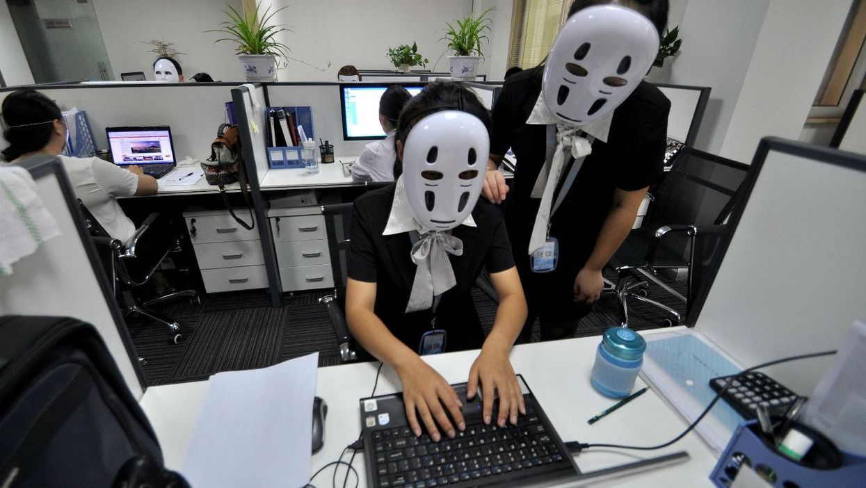 Why staff at a Chinese company have been wearing 'no-face' masks to work |  indy100 | indy100