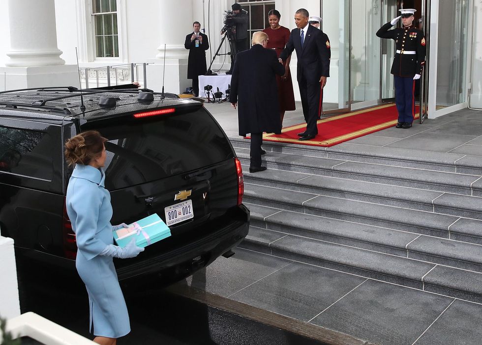 Picture: Donald Trump (C),and his wife Melania Trump (L), are greeted by President Barack Obama (R), and his wife first lady Michelle Obama, upon arriving at the White House on January 20, 2017 in Washington, DC