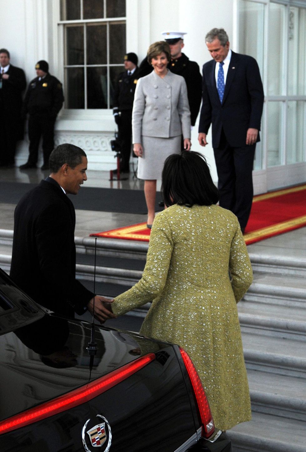 Picture: President-elect Barack Obama (L) and Michelle Obama (2nd R) are welcomed by U.S. President George W. Bush (R) and First Lady Laura Bus to welcome into the White House before Obama's Inauguration as the 44th president of the United States of America January 20, 2009 in Washington, DC