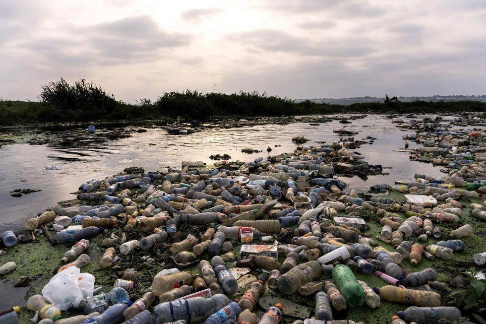Picture: The River Makelele which flows from the heart of Kinshasa into the Congo River, full of plastic bottles and rubbish
