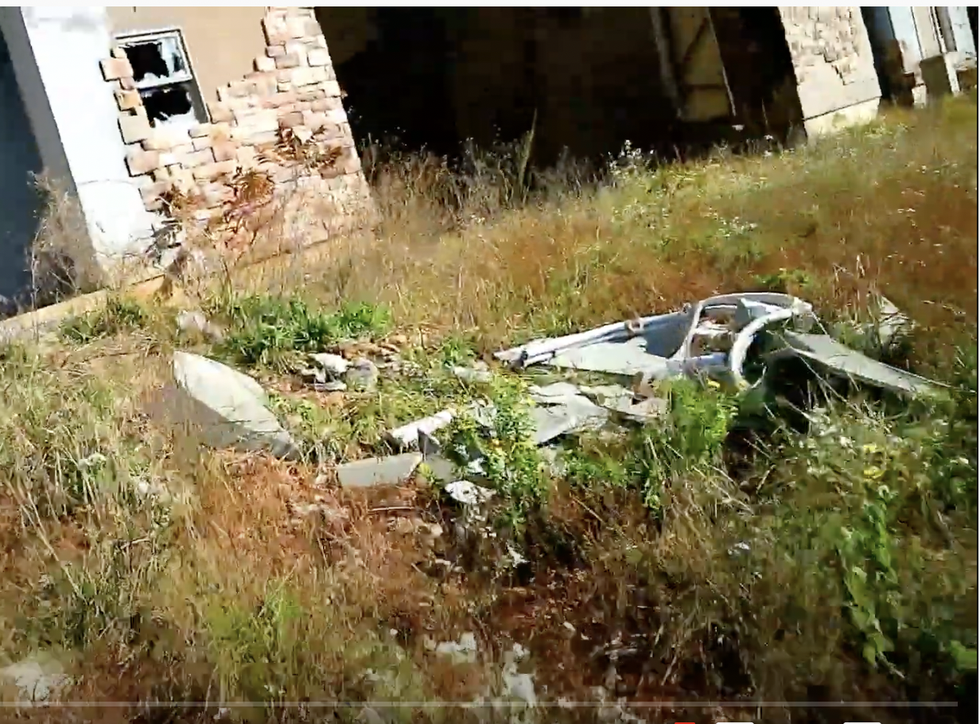 Pieces of wood and other material in grass