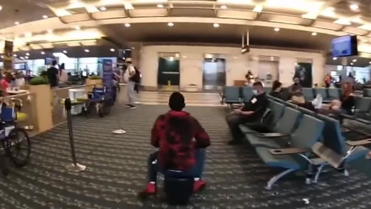 Police chase 'drunk' woman on motorised suitcase through airport