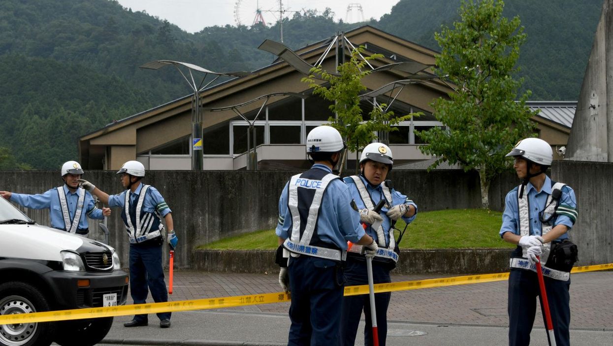 Police officers guard the care centre in Sagamihara where 19 people were killed on July 26, 2016.