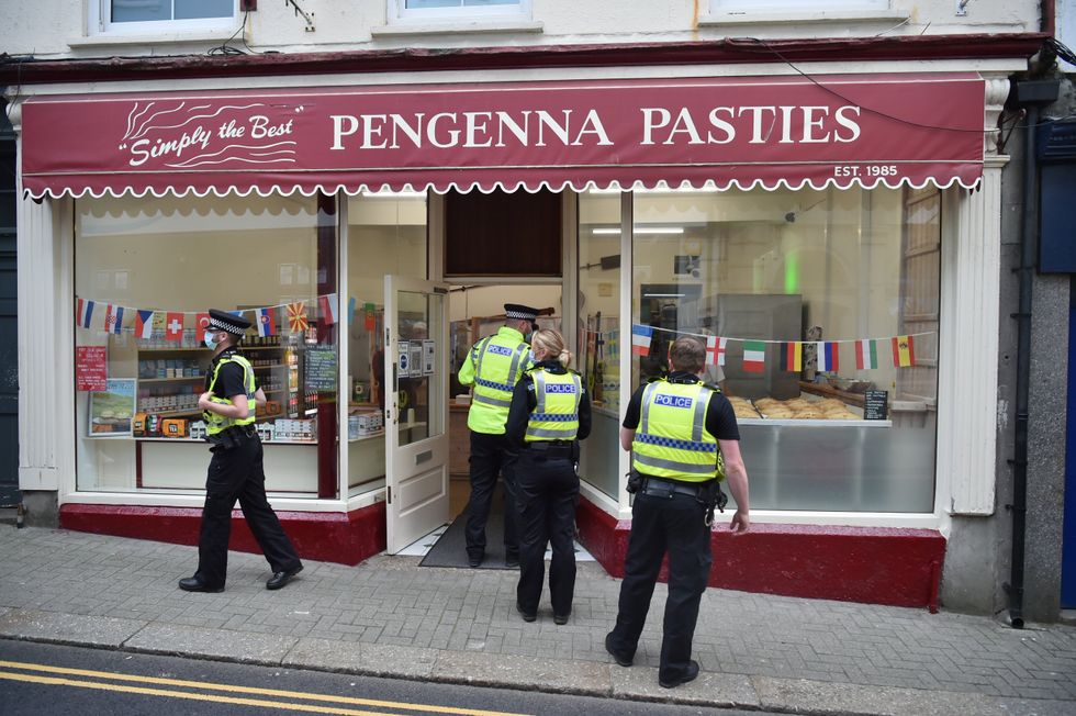 Police officers queuing for breakfast outside Pengenna Pasties in St Ives during the G7 summit in Cornwall