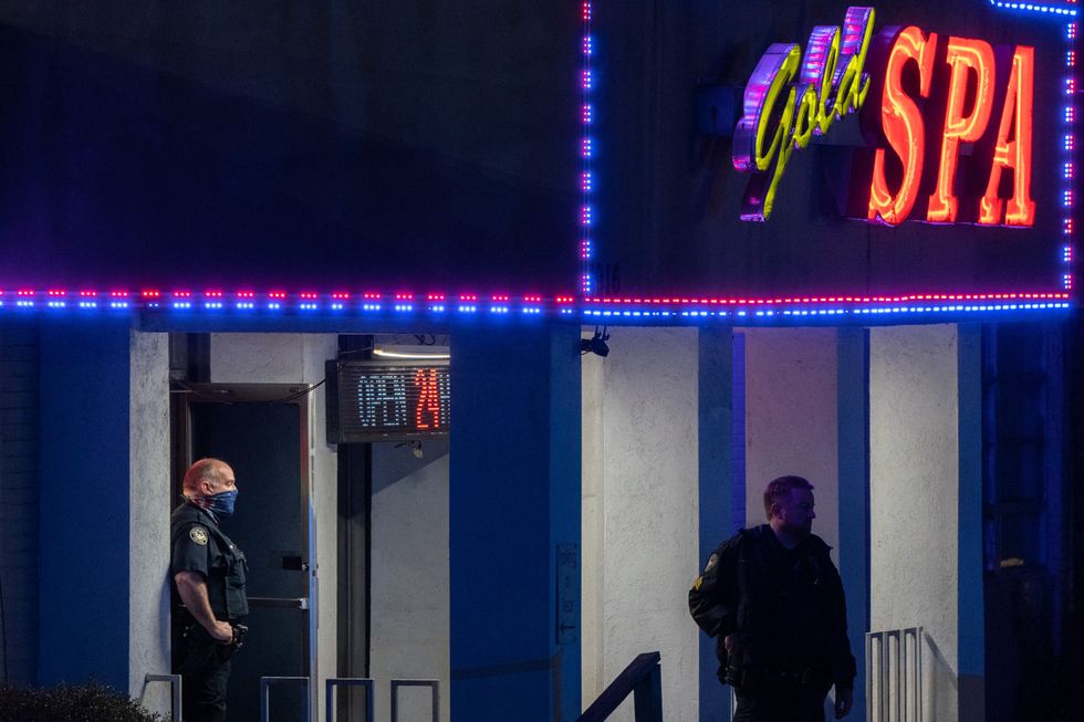 Police officers seen outside a massage parlour where three people were shot and killed on 16 March, 2021, in Atlanta, Georgia