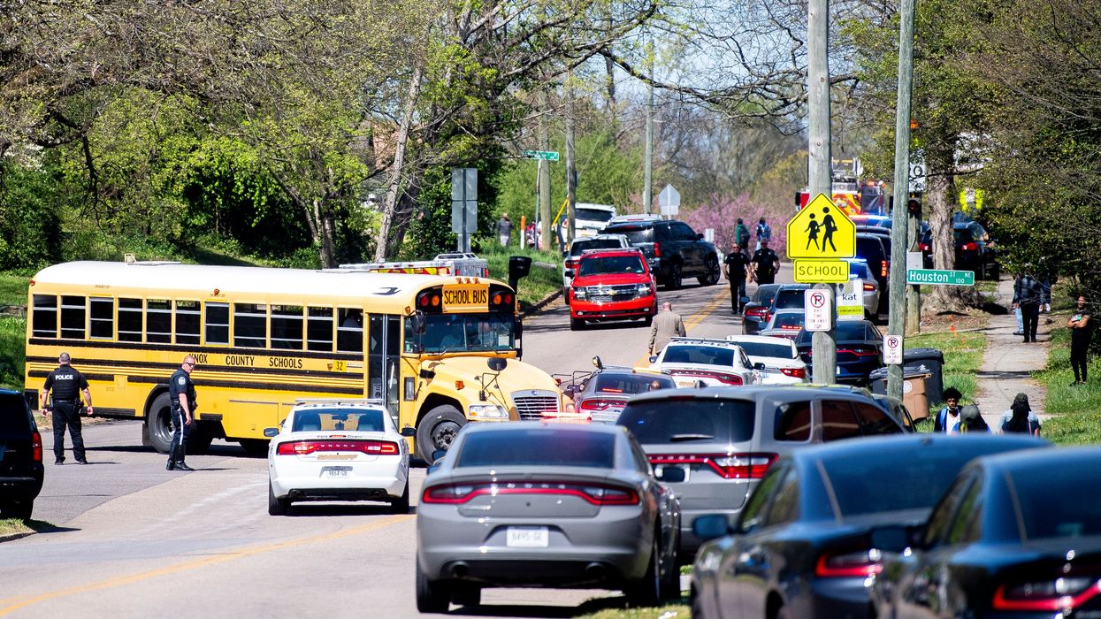 Police work in the area of Austin-East Magnet High School in Knoxville, Tennessee after a reported shooting