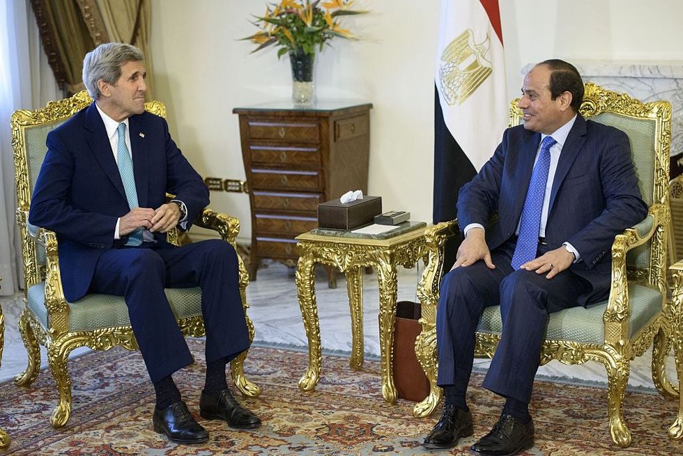 President el-Sisi (R) and US Secretary of State John Kerry sit before a meeting at the presidential palace in Cairo on 2 August 2015.