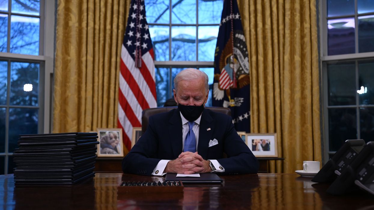 President Joe Biden sits in the Oval Office at the White House