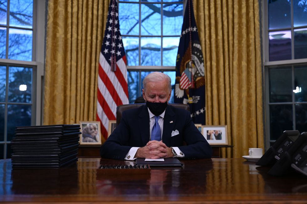 President Joe Biden sits in the Oval Office at the White House