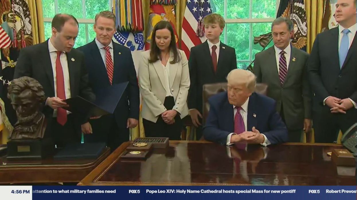 Donald Trump’s four-word question to aide amid bill signing raises alarm bells