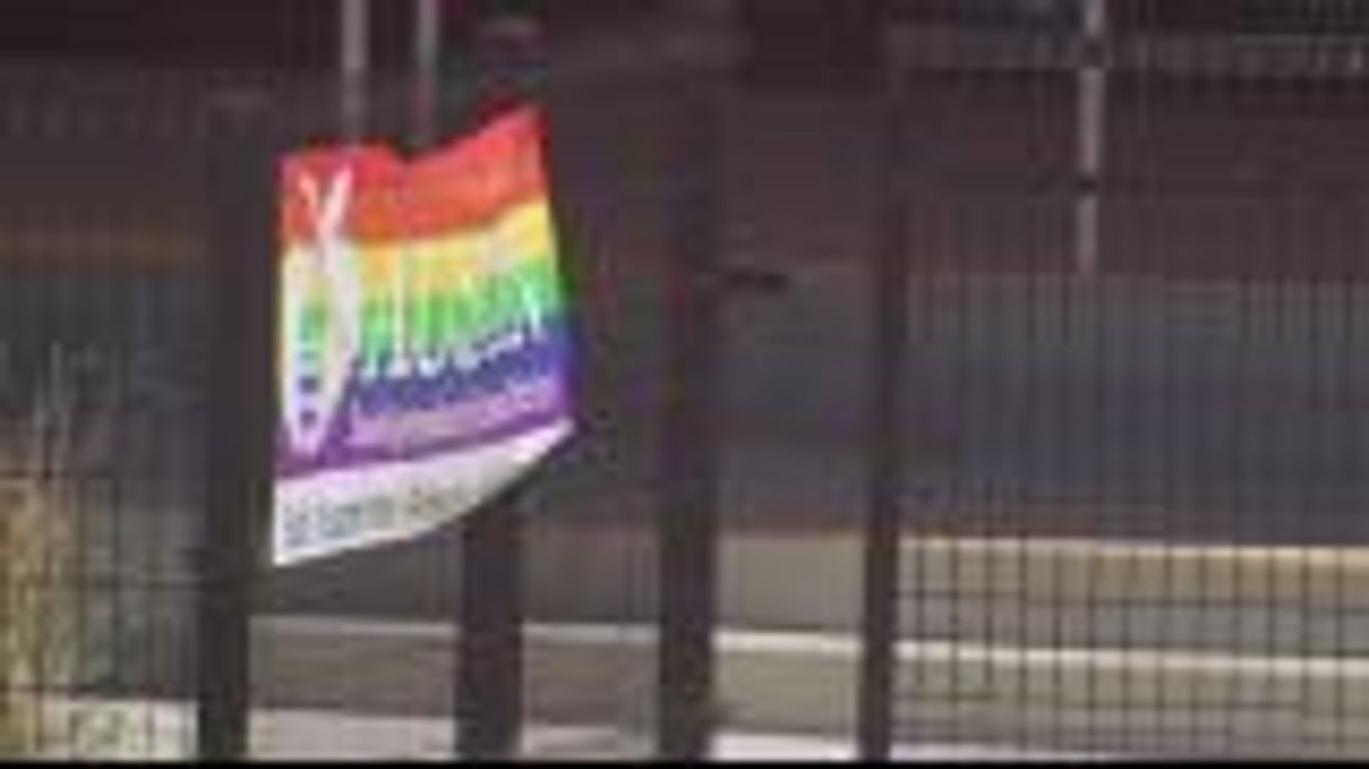 Dad fills garden with Pride flags after neighbor was mean about gay son