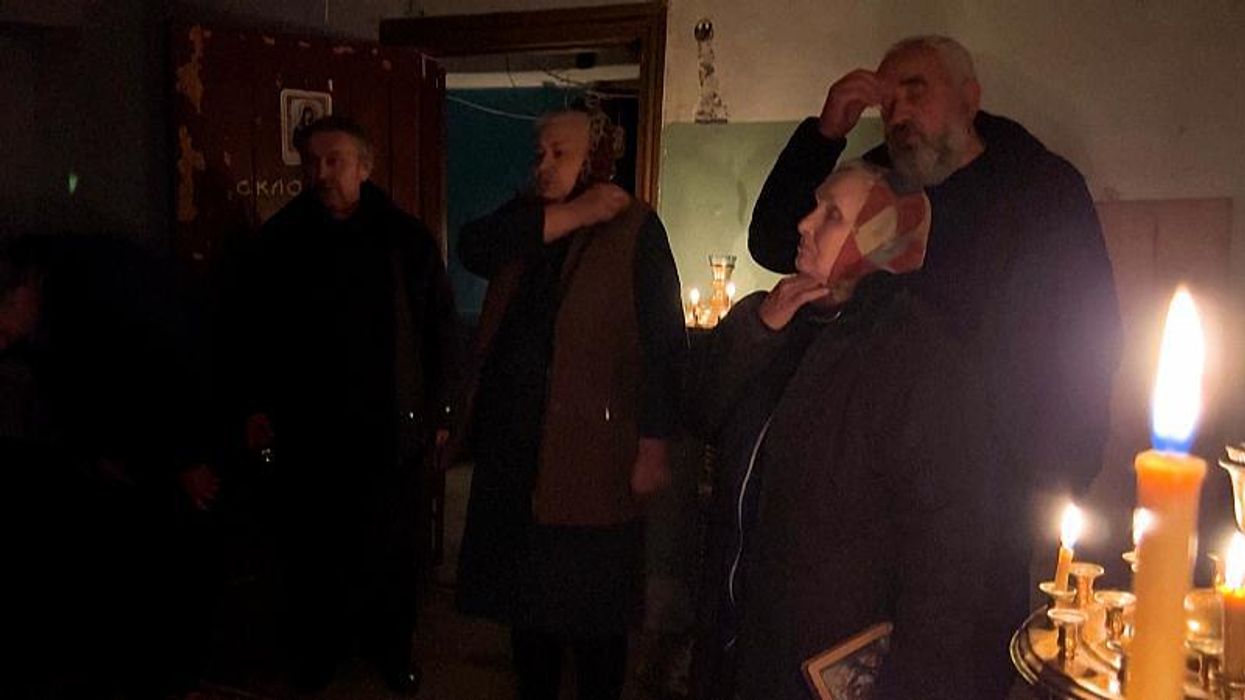 Mass held in basement of Ukraine church alongside sounds of Russian shelling