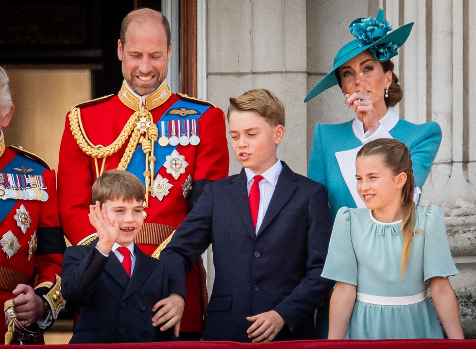 Royal decorum: George calms exuberant brother Louis during Trooping flypast